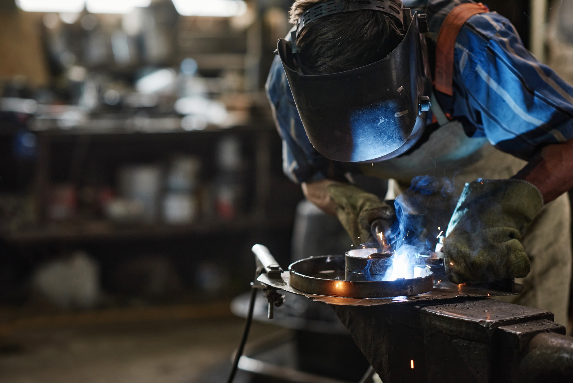 Man welding in workshop